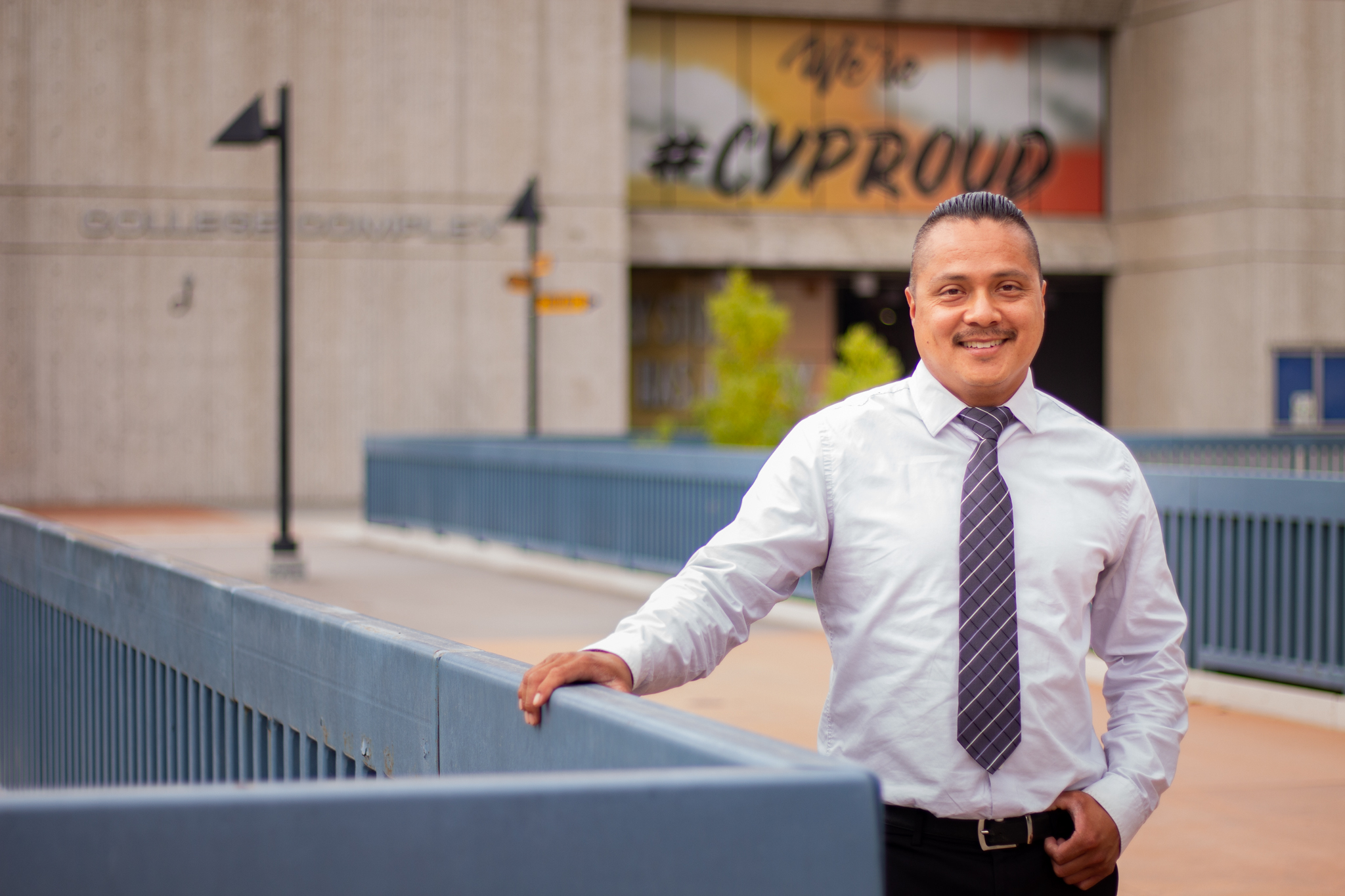 David Garcia poses on the second-level piazza of Cypress College. 